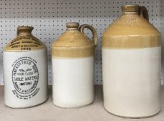 A collection of five stoneware flagons comprising 