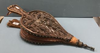 A pair of late 19th Century Scottish carved oak and studded leather bellows decorated with thistle