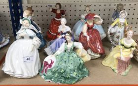 A collection of Royal Doulton figurines comprising 