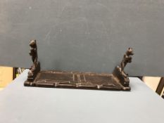 A Black Forest carved treen ware adjustable book slide as skiing bears,