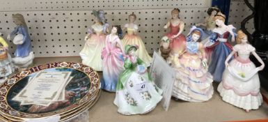 A collection of Royal Doulton figurines comprising 