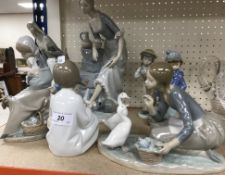 A collection of three Lladro figure groups to include 