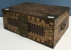 A gilded and embossed leather and brass