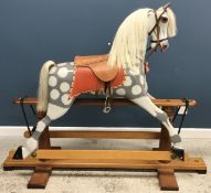 A modern Dapple Grey rocking horse on sa
