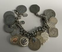A silver link charm bracelet mounted wit
