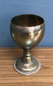 A circa 1900 white metal goblet with gil