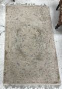 A Chinese rug, the central panel set wit