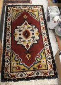 A mid 20th Century rug, the central pane