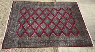 A Bokhara type rug, the central panel se