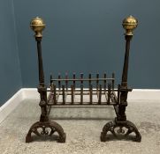 A pair of brass and iron fire dogs of la