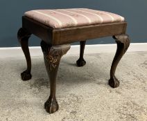 A late 19th Century walnut framed dressing stool in the early Georgian manner with shell carved