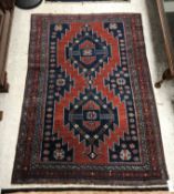 A Caucasian rug, the central panel set w
