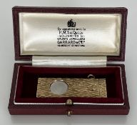 A 9 carat gold bark effect cigar cutter