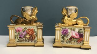 A pair of circa 1805 Worcester Flight Barr and Barr candlesticks in the Empire taste with "Sphinx