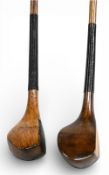 2x Scare neck woods incl a light stained beechwood brassie stamped C Brand with central fibre insert