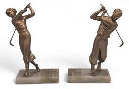 Pair of Golfing Figures Bookends c1930, a male and female golfers in swing on marble base