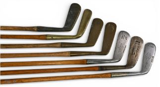 7x Assorted putters incl Trueline mussel back long blade, Spalding Anvil marked putting cleek,