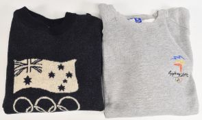 Sydney 2000 Olympic Games clothing to include: a scarce blue sweater size XL and a grey sweater size