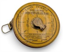 An early 20th century lawn tennis measure, 78ft tape, court marking out tape measure 11.5cm dia
