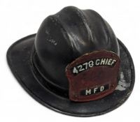 USA Fire Helmet made by Cairns Bros with 4278 Chief MFD leather badge to front, missing its liner,