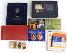 A collection of Presentation packs, first day cover and tea cards to include a Benham 1981 Royal