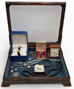 Jewellery glass topped display case with silver and costume jewellery, ladies watches, 66g of silver