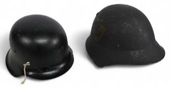 An Argentine M38 Helmet with leather lining, plus modern WW2 German style helmet also with lining (
