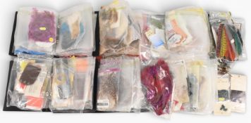 A large collection of fly tying material in folders and bundles, as follows: 3x capes, deer hair and
