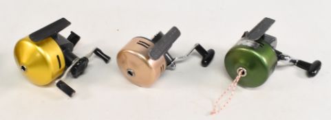 An Abumatic 110 spinning reel, yellow housing, good, a Crown Planet 65 bait casting reel, with