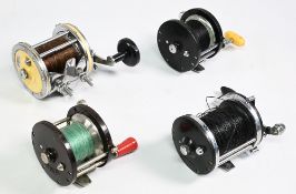 Four vintage sea fishing multiplier reels, Penn 85 Bakelite, Penn 285 Bakelite, Intrepid Buccaneer