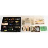 Mixed selection of fresh and saltwater lures, including jointed plugs, rubber frog, metal