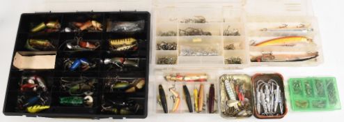 Mixed selection of fresh and saltwater lures, including jointed plugs, rubber frog, metal