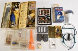 Mixed collection of fly tying materials, including feathers, varnish, hooks, plus various tools