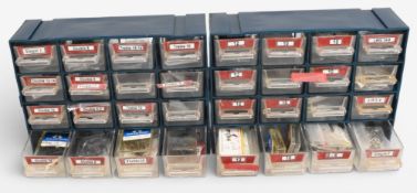 2x multi compartment slide tray boxes holding a good range of fly tying hooks, from size 2 to size