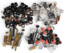 Collection of Rod Maker spare parts: reel rings, ferrules, butt parts, and rubber butt caps, a
