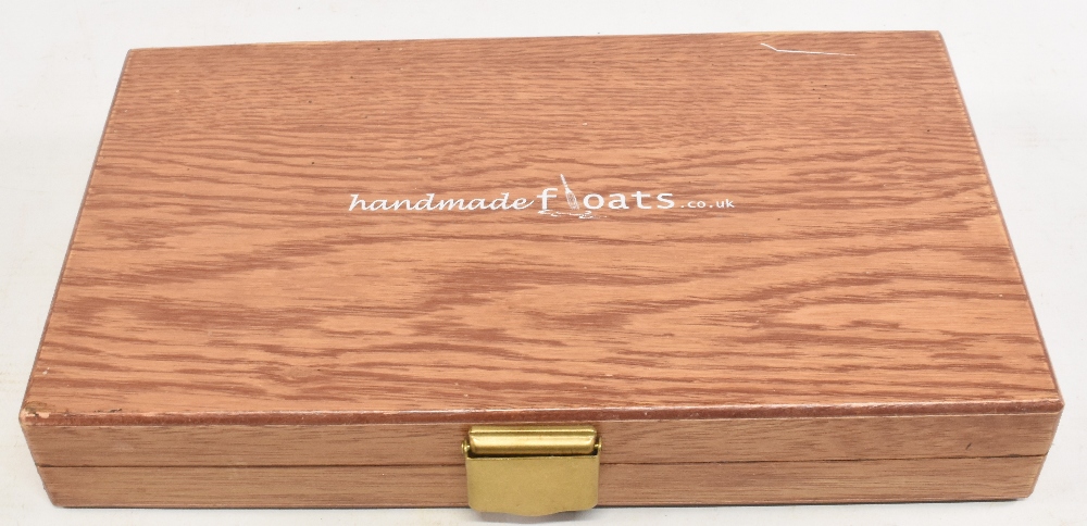 Box of 1handmade floats by Andy Bachelor, dated 2009, in quill and balsa, assorted patterns