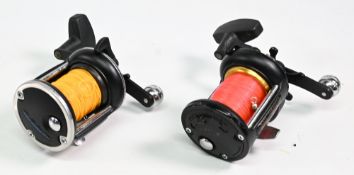 2x Penn multiplier reels to include 525 reel with power handle, graphite frame, and a 525 MAG reel