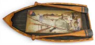 Decorative fishing Diorama of a wooden half boat standing 25” tall, with various vintage accessories