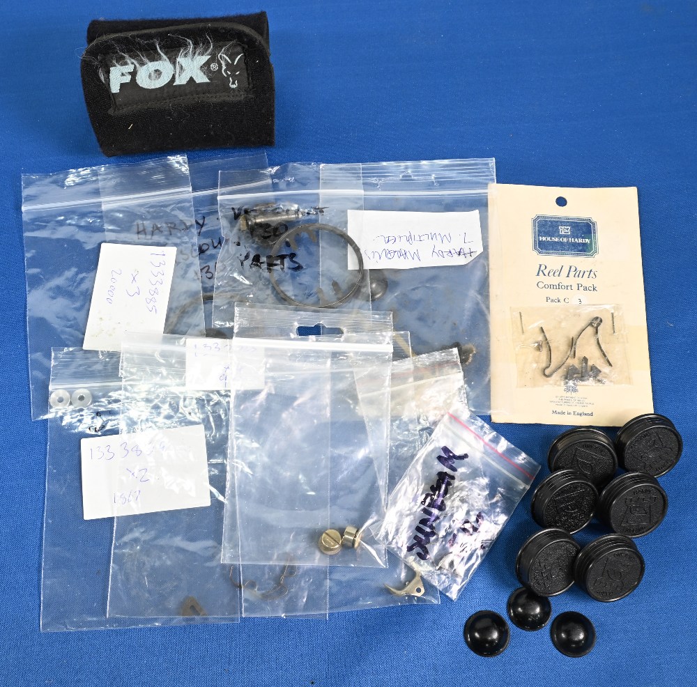 Collection of Hardy fly reel spare parts, as follows: 6x plastic spool cog covers. 3x scarce spindle