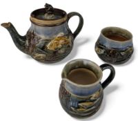Royal Doulton Stoneware three part tea set by George Tinworth, G T monogram to the lid of the teapot