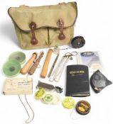 Traditional canvas/leather tackle bag, holding mixed collection of fly-fishing accessories, wood/