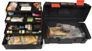 2x cantilever boxes stuffed with a quantity of fly-tying materials, including feathers, silks, wool,