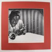 AUTOGRAPH - MILES DAVIS - JAZZ MUSICIAN - b&w photograph showing him with his trademark trumpet,