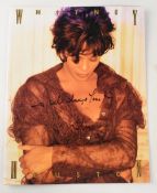 AUTOGRAPH - WHITNEY HOUSTON tour programme signed across the front cover faded