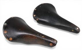 Vintage Brooks leather cycling saddles – features a Brooks Professional and Brooks B17 example –