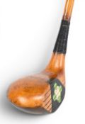 Peerless Patent brassie stamped to the brass sole plate with decorative fancy face central insert