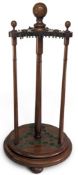 Billiards and Snooker - An Edwardian mahogany revolving cue stand, with globe finials, on turned