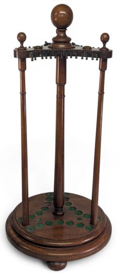Billiards and Snooker - An Edwardian mahogany revolving cue stand, with globe finials, on turned