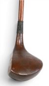 Playable large head left hand brassie indistinctly stamped to the crown, solid construction,