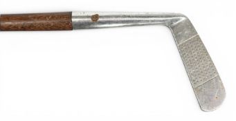 Unusual M J Lewis perfect putter with regd number 748219 tot the rustless straight blade head with